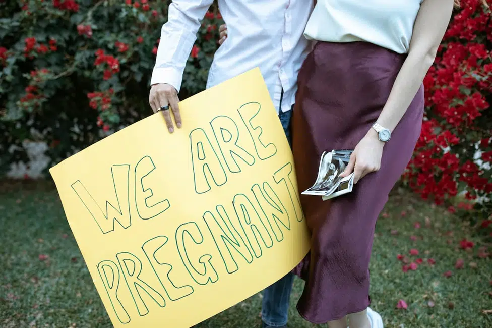 "23 weeks pregnant belly showing baby bump with fetus size and weight details"