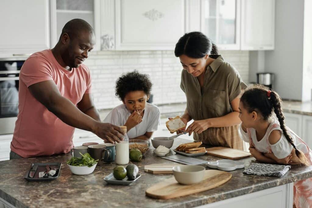 Happy parents spending quality time with their child — parenting tips for raising healthy, confident kids
