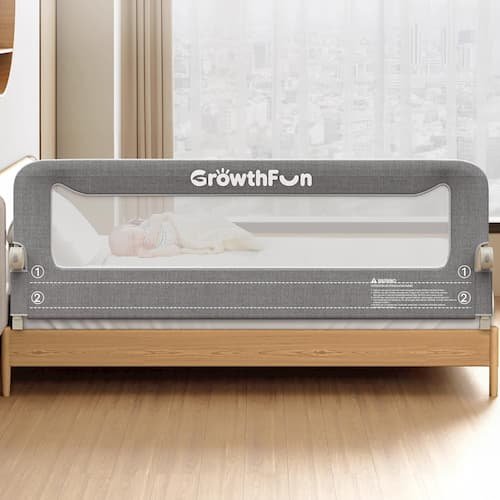 A 71-inch grey foldable bed rail for toddlers with a reinforced carbon steel frame and breathable cationic fabric, shown installed on a bed to prevent accidental falls.