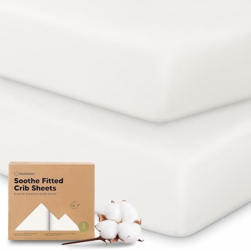 KeaBabies 2-pack organic cotton crib sheets on a fitted toddler mattress showing breathable soft fabric.