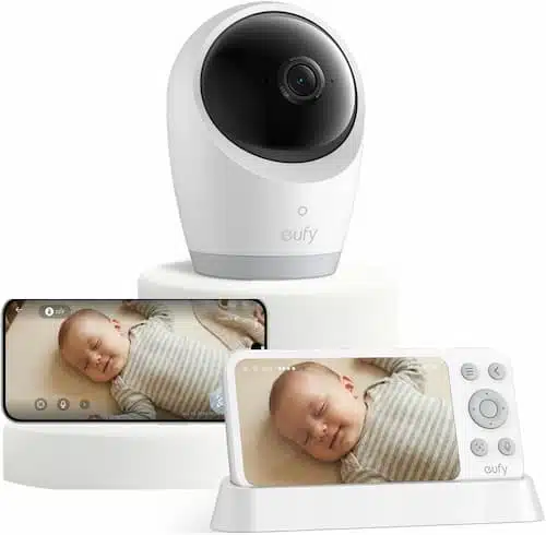 eufy security hybrid baby monitor displaying a sleeping infant on both a handheld parent unit monitor and a camera setup.
