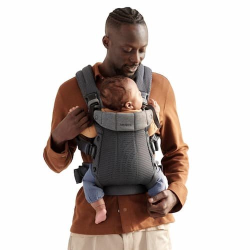 BabyBjörn Baby Carrier Harmony in anthracite 3D mesh worn by a father holding an infant.